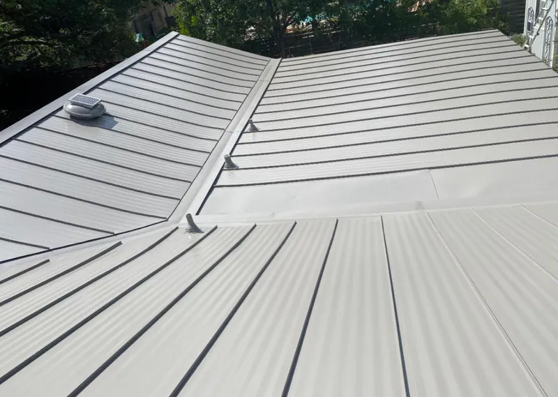 Solar attic fan installed on a metal roof for Roof Ventilation in Arcata